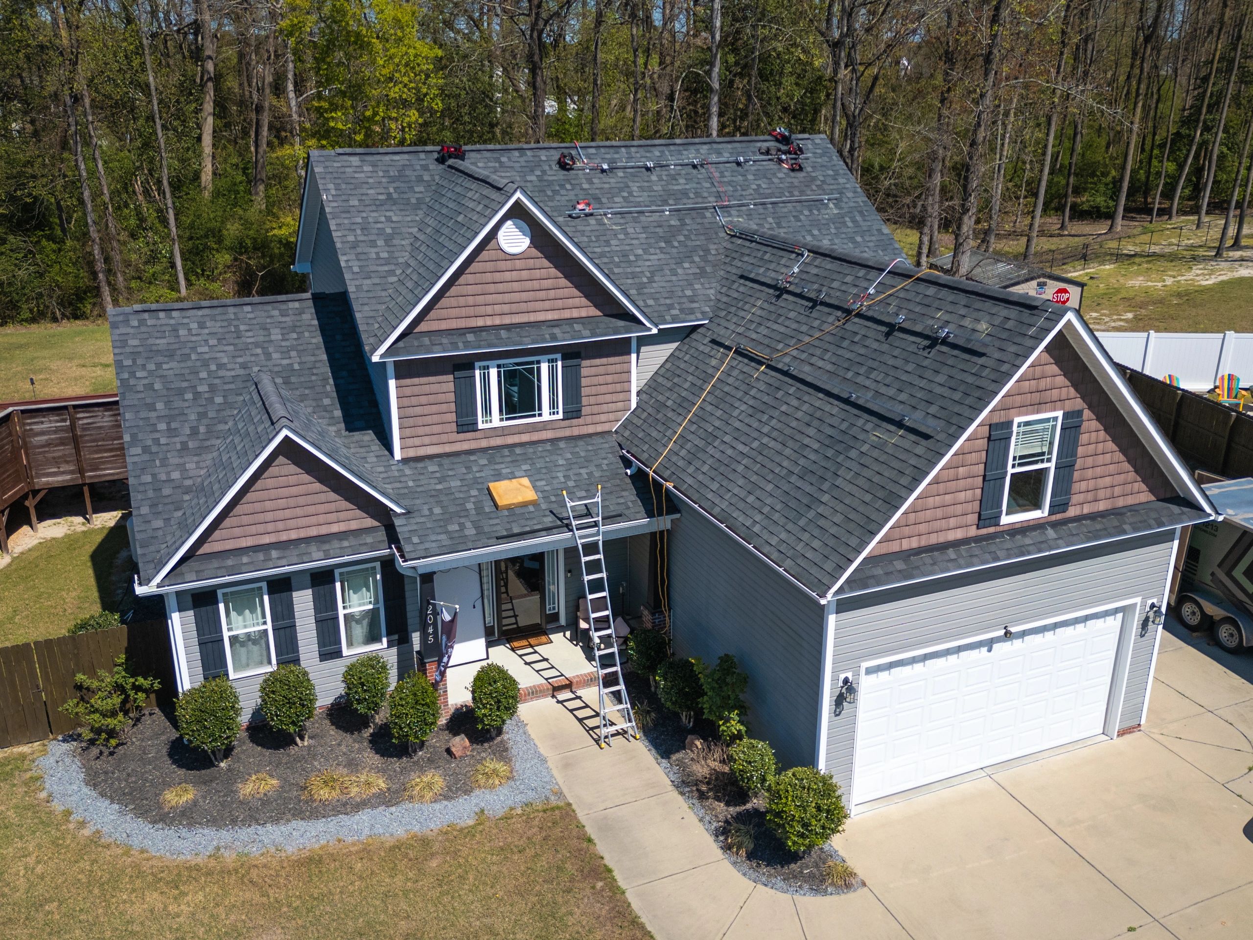 Houston-area home exterior with roofing improvements